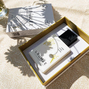 Image of the Cedar wood and vanilla fragrance in it's box with shades of flowers on top